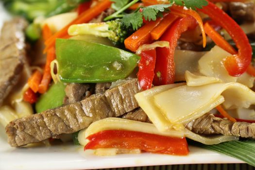 Freshly prepared beef noodle stirfry ready to serve.