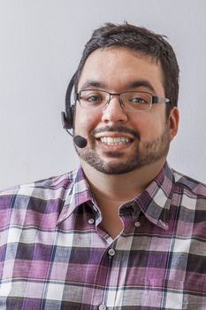Overweight man with headset against a white background