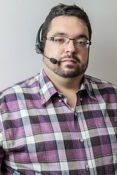 Overweight man with headset against a white background