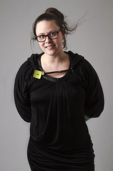 Woman wearing a black dress with wispy flowing hair