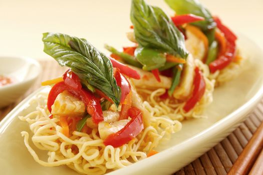 Delicious Asian chilli chicken on beds of crispy noodles.