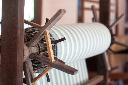 Silk weaving on a hand loom in thailand