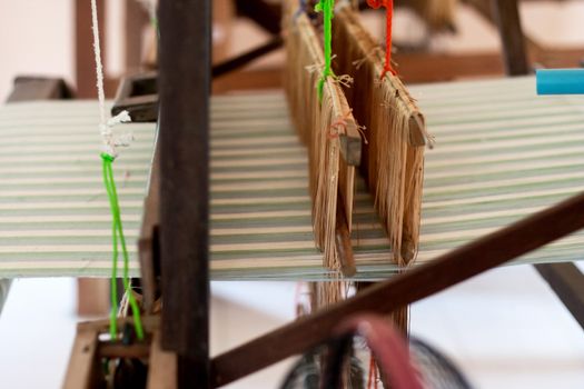 Silk weaving on a hand loom in thailand