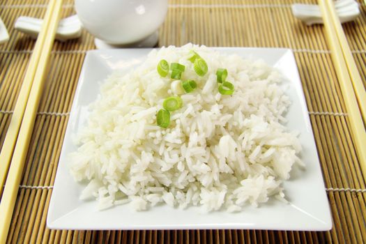 Delicious boiled rice with diced shallots ready to serve.