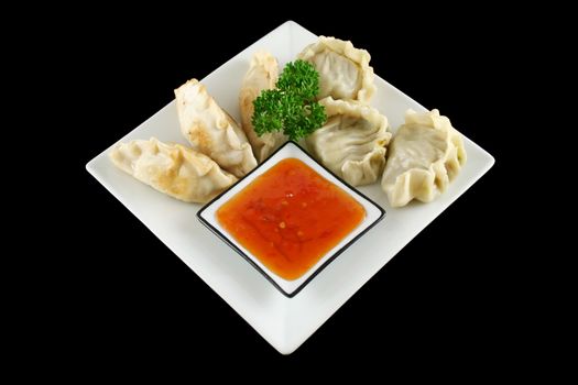 Delicious fried pork and vegetable Chinese dumplings ready to serve.