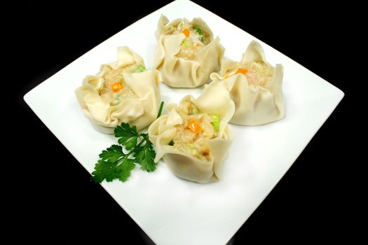 Freshly prepared dim sums ready for the steamer.