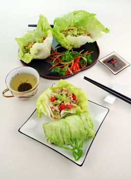 Delicious San Choy Bow with minced chicken and Chinese vegetables wrapped in fresh lettuce leaves.