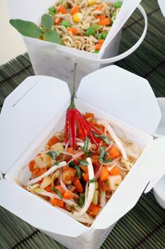 Chili rice noodle vermiceli in take away containers.