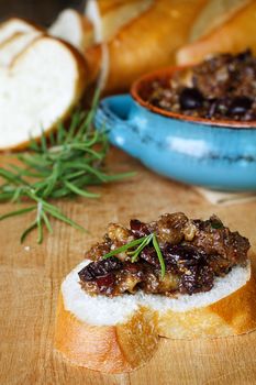 French bread with Fig Tapenade prepared with figs, kalamata olives and fresh herbs.