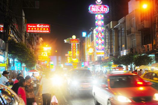 Bangkok, Thailand - March 03, 2013: Busy Yaowarat Road in the evening in Bangkok. Yaowarat Road is a main street in Bangkok's Chinatown,  was opened in 1891 in the reign of King Rama V. 