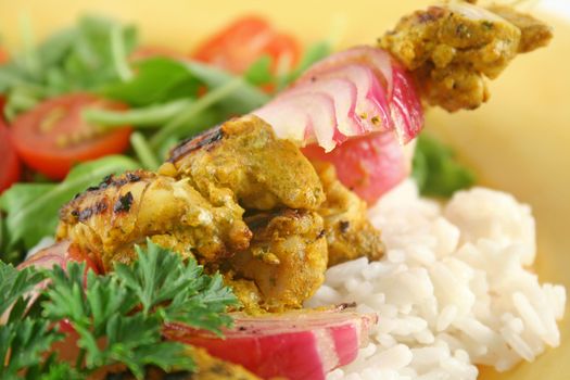 Chicken tandoori skewers with minted yogurt and a rocket salad.