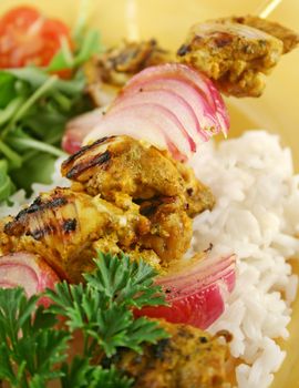 Chicken tandoori skewers with minted yogurt and a rocket salad.