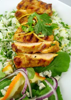 Delicious chicken tikka on a bed of lemon coriander rice with salad.