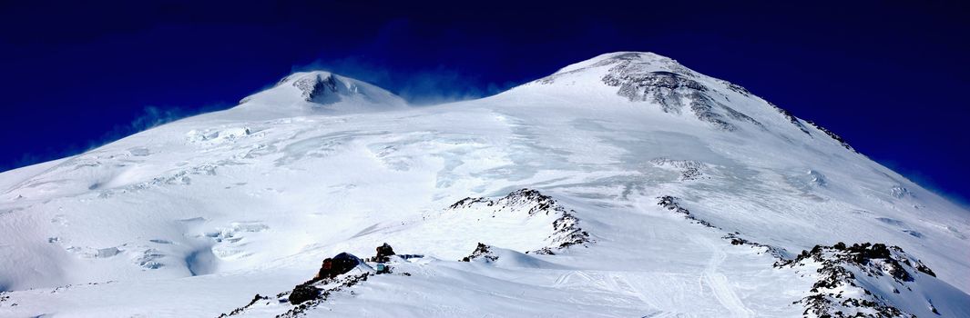 Elbrus - a sleeping volcano cone with two peaks.