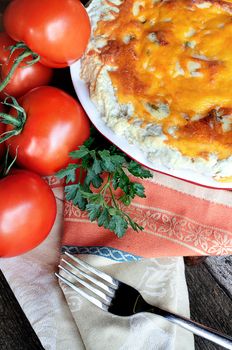 Freshly baked tomato pie with tomatoes on the vine.