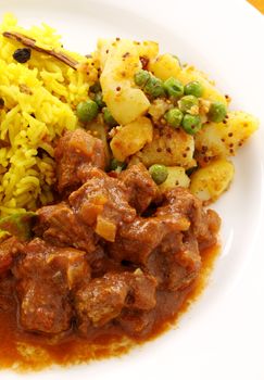 Delicious and spicy Indian beef curry served with pappadums.