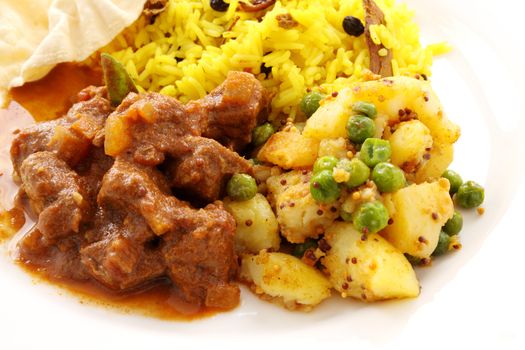 Delicious and spicy Indian beef curry served with pappadums.