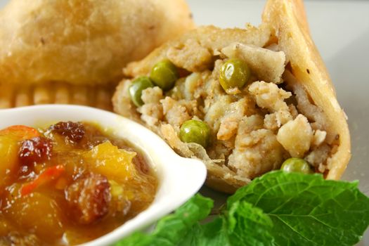 Indian vegetarian potato and pea samosa with mango chutney.