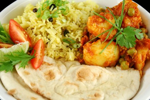 Indian pea and potato curry with tumeric rice and a side salad.