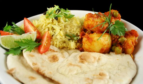 Indian pea and potato curry with tumeric rice and a side salad.