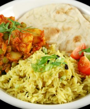 Indian pea and potato curry with tumeric rice and a side salad.