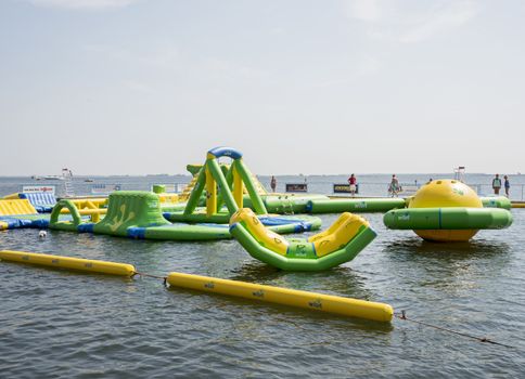 HELLEVOETSLUIS,HOLLAND - JULY 08:Unidentified children having pun in the aqua splash park ,on July 08,2013 in Hellevoetsluisk, Holland.This water park is the only open water park in Holland