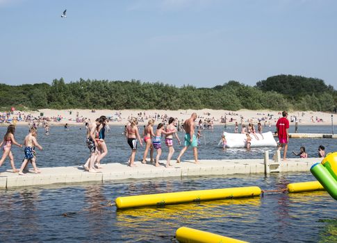 HELLEVOETSLUIS,HOLLAND - JULY 08:Unidentified children having pun in the aqua splash park ,on July 08,2013 in Hellevoetsluisk, Holland.This water park is the only open water park in Holland
