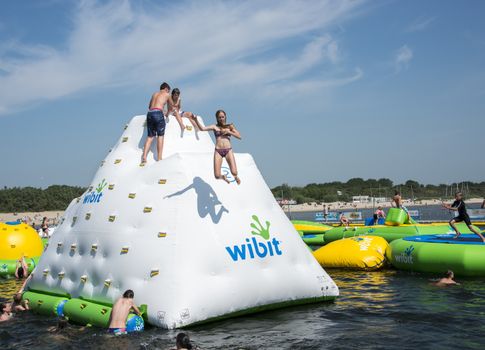 HELLEVOETSLUIS,HOLLAND - JULY 08:Unidentified children having pun in the aqua splash park ,on July 08,2013 in Hellevoetsluisk, Holland.This water park is the only open water park in Holland