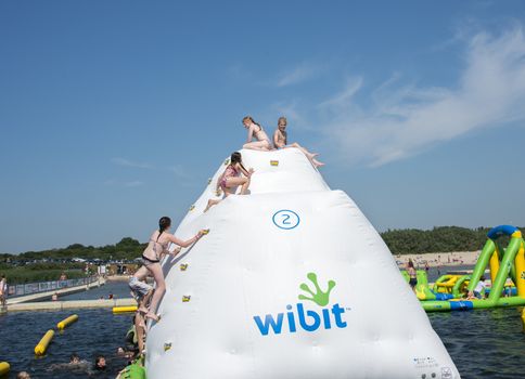 HELLEVOETSLUIS,HOLLAND - JULY 08:Unidentified children having pun in the aqua splash park ,on July 08,2013 in Hellevoetsluisk, Holland.This water park is the only open water park in Holland