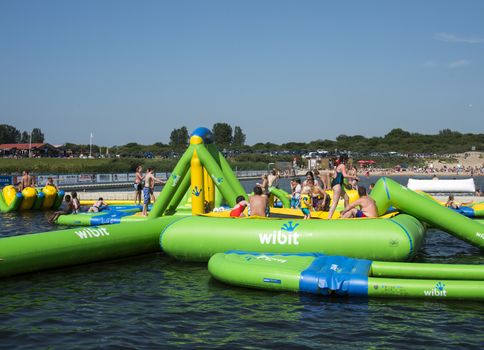 HELLEVOETSLUIS,HOLLAND - JULY 08:Unidentified children having pun in the aqua splash park ,on July 08,2013 in Hellevoetsluisk, Holland.This water park is the only open water park in Holland