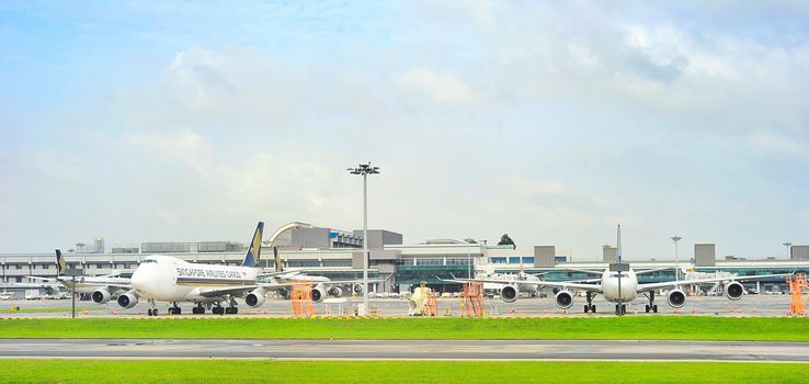 Singapore - March 05, 2013 : Changi International Airport. Changi Airport serves more than 100 airlines operating 6,100 weekly flights connecting Singapore to over 220 cities in about 60 countries worldwide