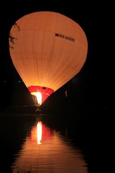 Hot air baloon landing on the lake