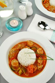 Delicious chicken gumbo with rice, sausage, peppers, onions, carrots and tomatoes.