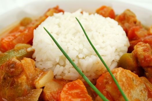 Delicious chicken gumbo with rice, sausage, peppers, onions, carrots and tomatoes.