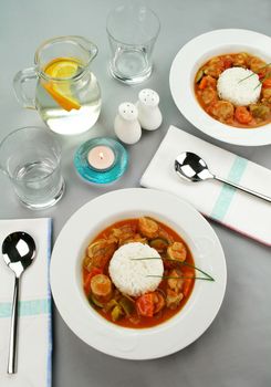 Delicious chicken gumbo with rice, sausage, peppers, onions, carrots and tomatoes.