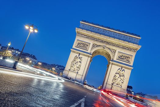 Arc de Triomphe, Paris, France at night.