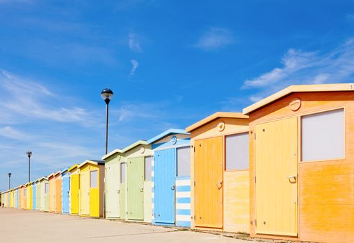 Colourful beach cabins in England