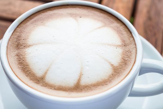 Milk microfoam topped on hot cafe mocha cup