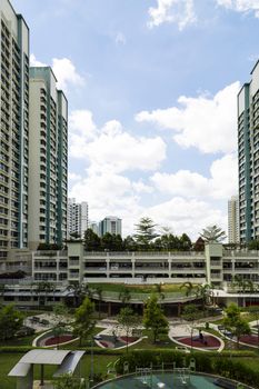 Vertical shot of a residential estate with carparks and playground.