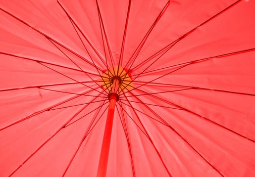 Red umbrella under the sun
