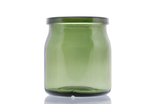 Empty green glass jar isolated on white background close up.