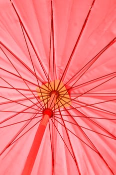 Red umbrella under the sun