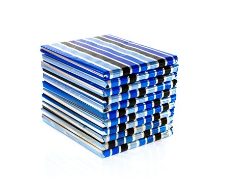 stack of presents in blue silver and black isolated on white background
