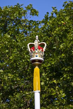 A Royal Crown on one of the flag poles down The Mall in London.