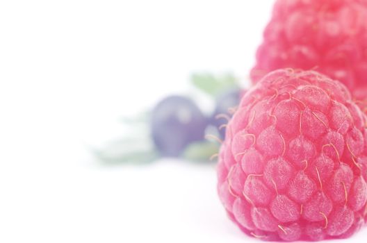 Raspberries on a white background close-up