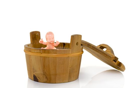 plastic baby toy in wooden  bath