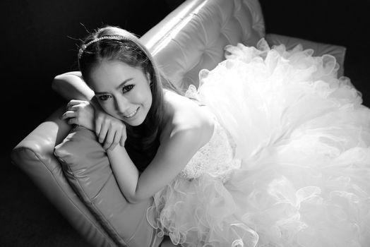 black and white portrait of beautiful bride is smiling