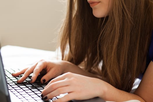 Woman near the notebooks keyboard