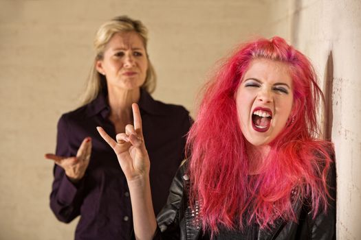 Angry parent with loud teenager with pink hair