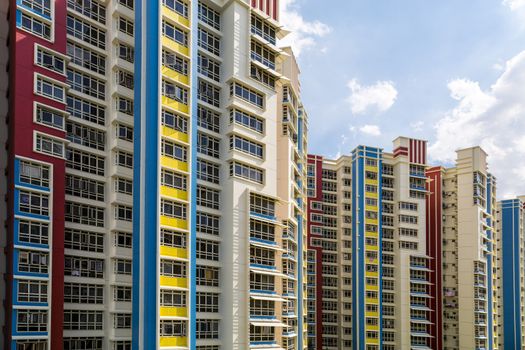 A group of high rise colorful residential apartments.